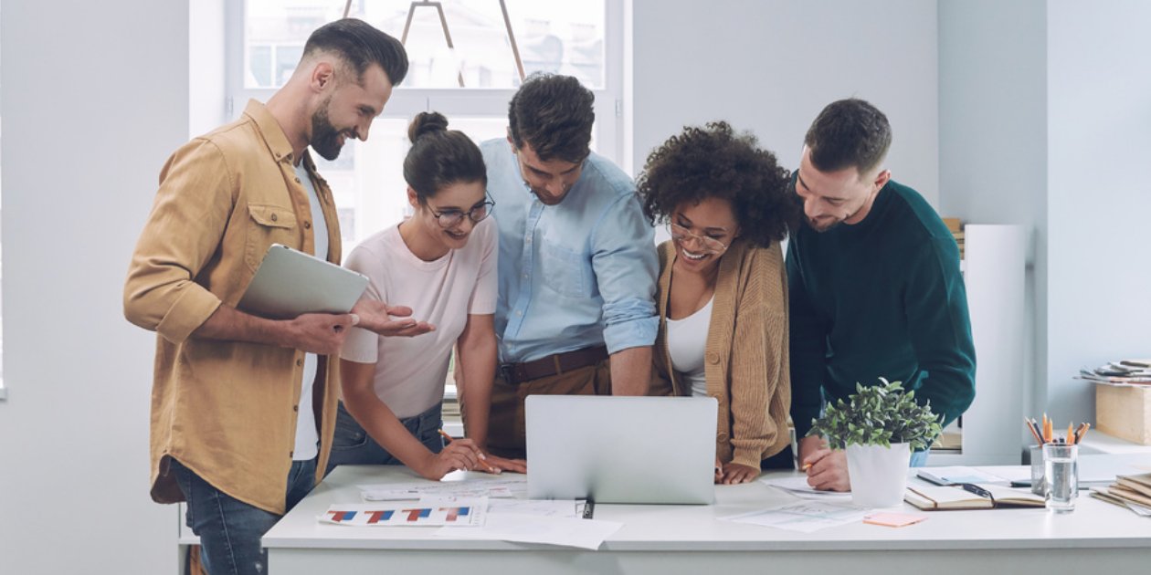 group looking at a laptop together