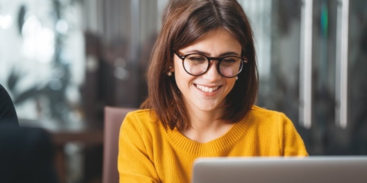 Smiling woman at her computer