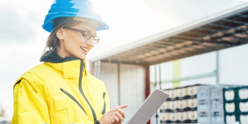 Transportation manager looking at data on a tablet