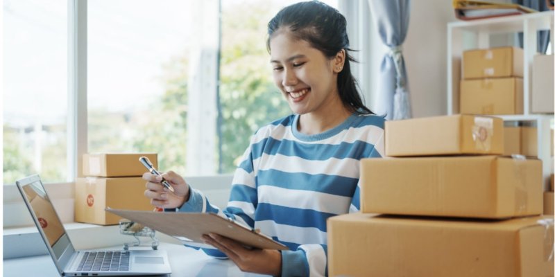 woman working on a laptop reviewing the EDI services
