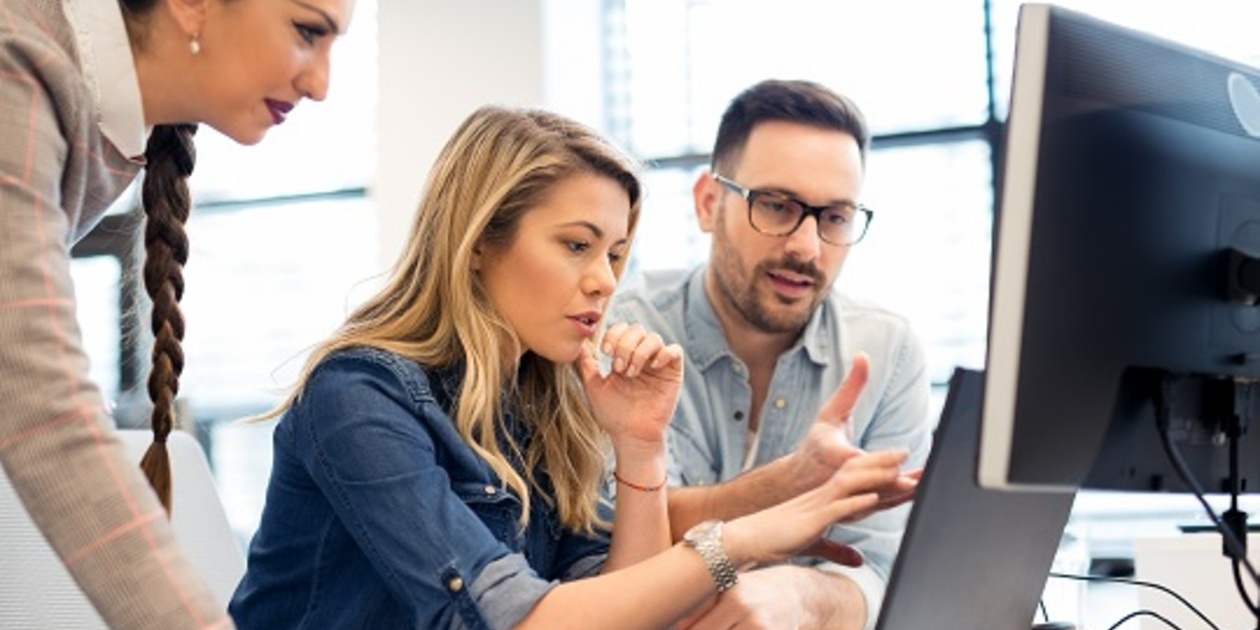 Three colleagues having a discussion